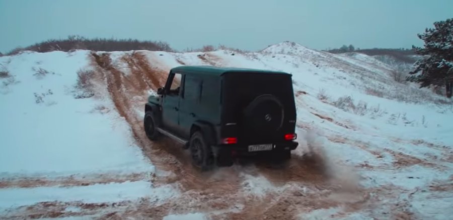 Watch Luxury SUVs and Rugged Race up to Snowy Hill