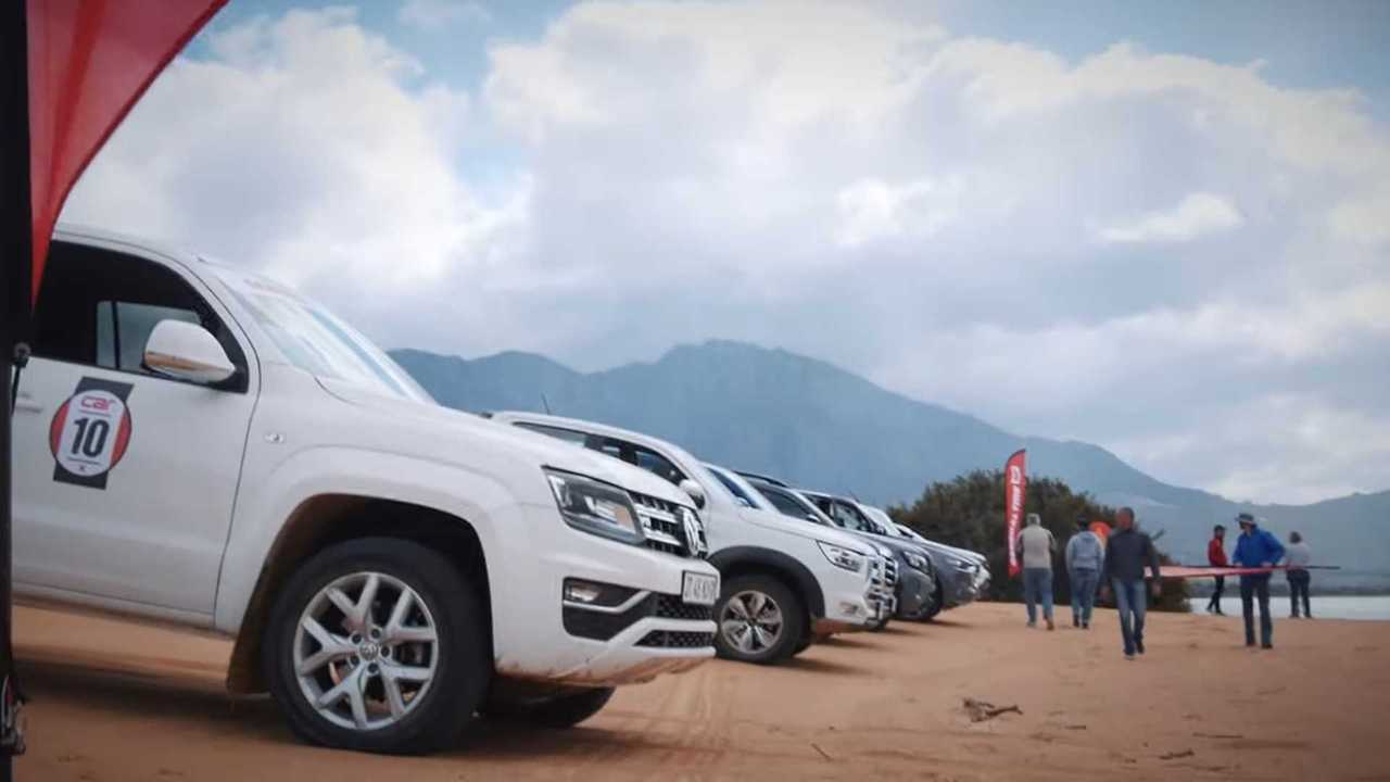 Ten Pickup Trucks Race in the Sand