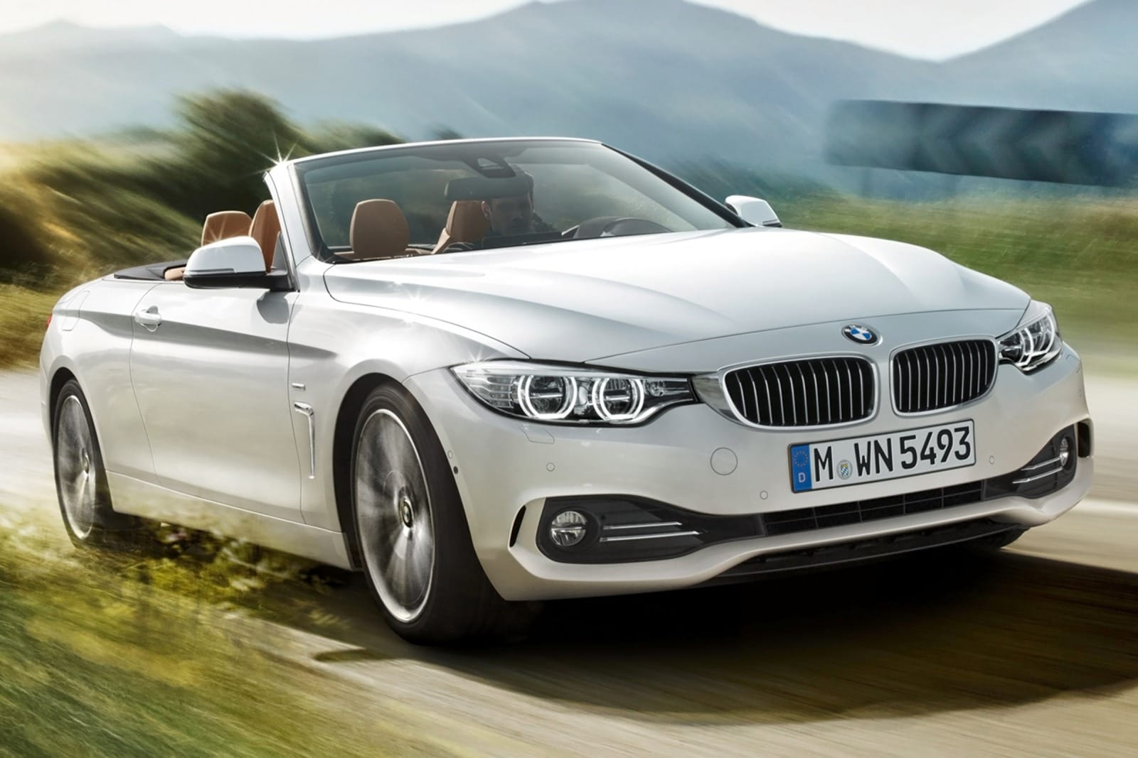 2014 BMW 4-Series Convertible photographed with the top down in minimal camo