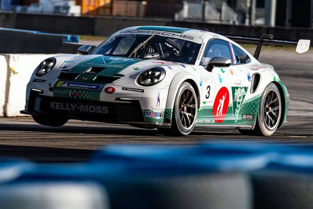 Porsche 911 GT3 racecar finishes on top of another 911 GT3 in Carrera Cup France race