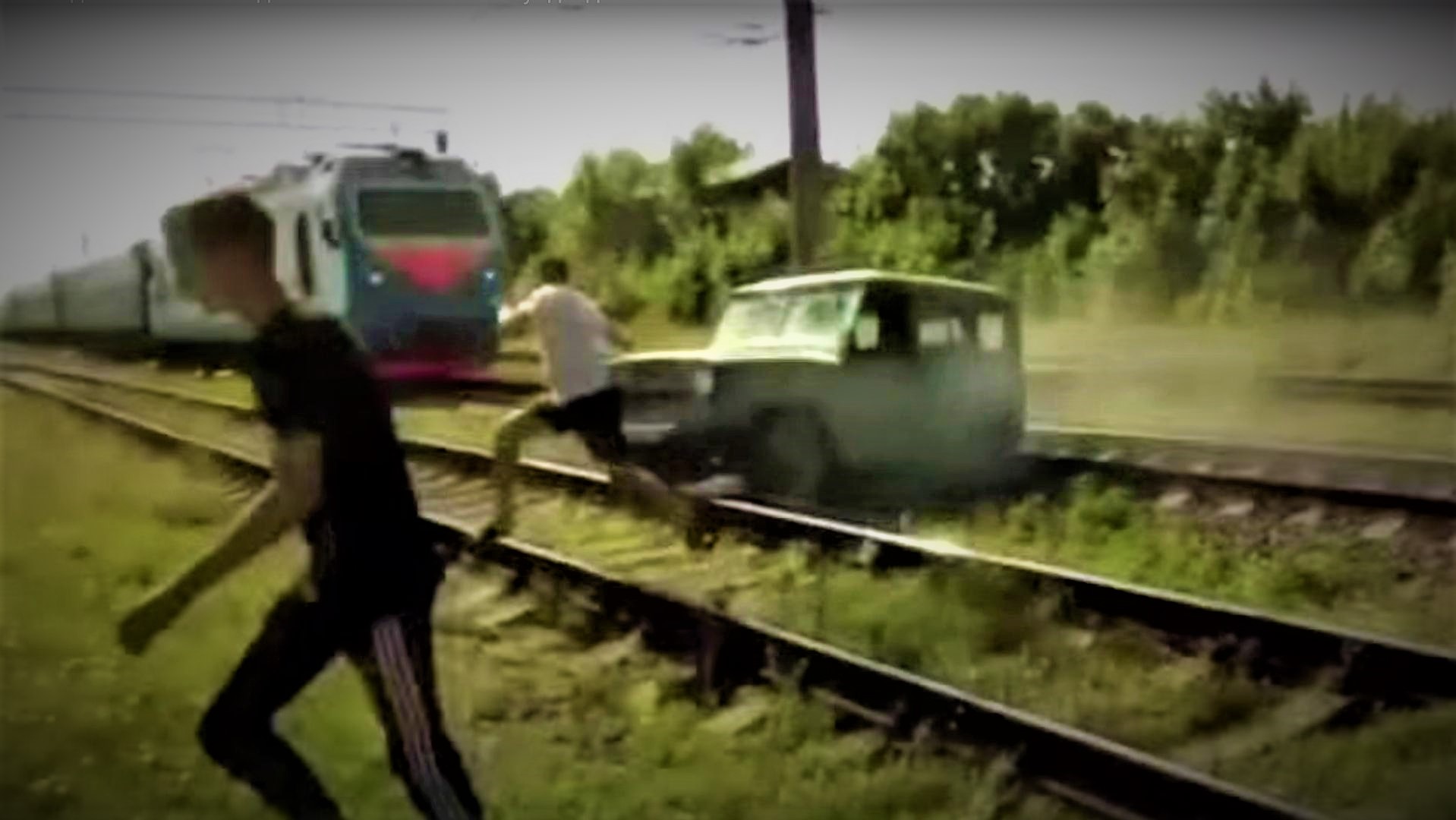 Watch This Driver Bail from an SUV as It's Smash by Train