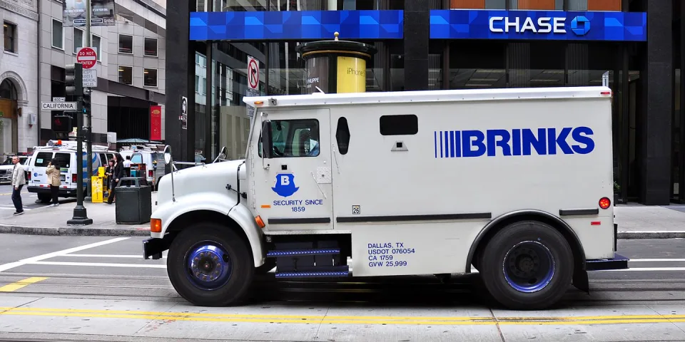 Armored Truck loses $600K after rear door opens on highway