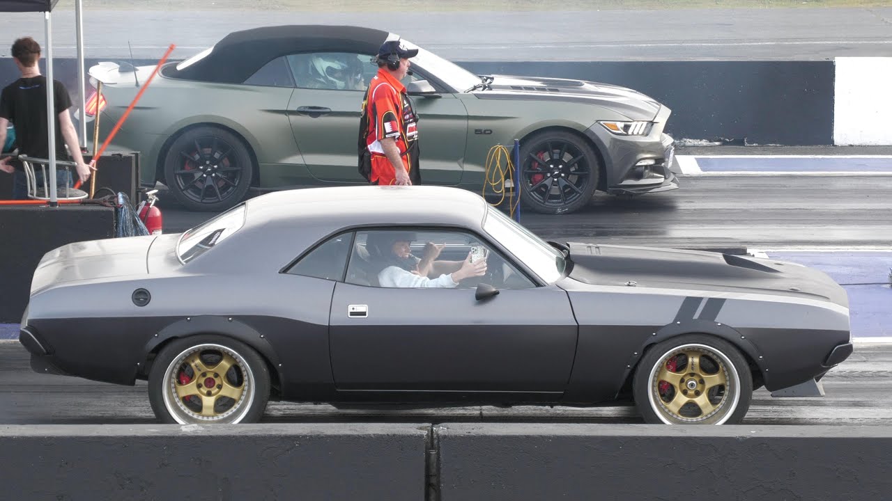 You can watch 10 minutes of drag racing action between old and new muscle cars