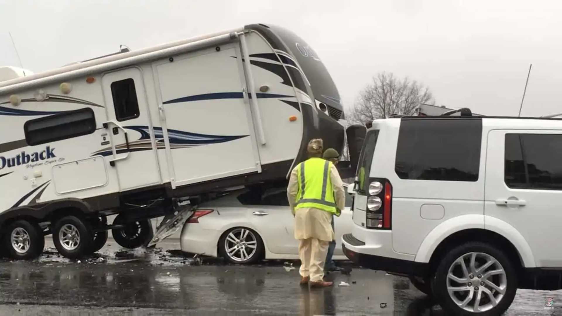 Crazy Crash: Nissan Slides Completely Under the Camper Trailer