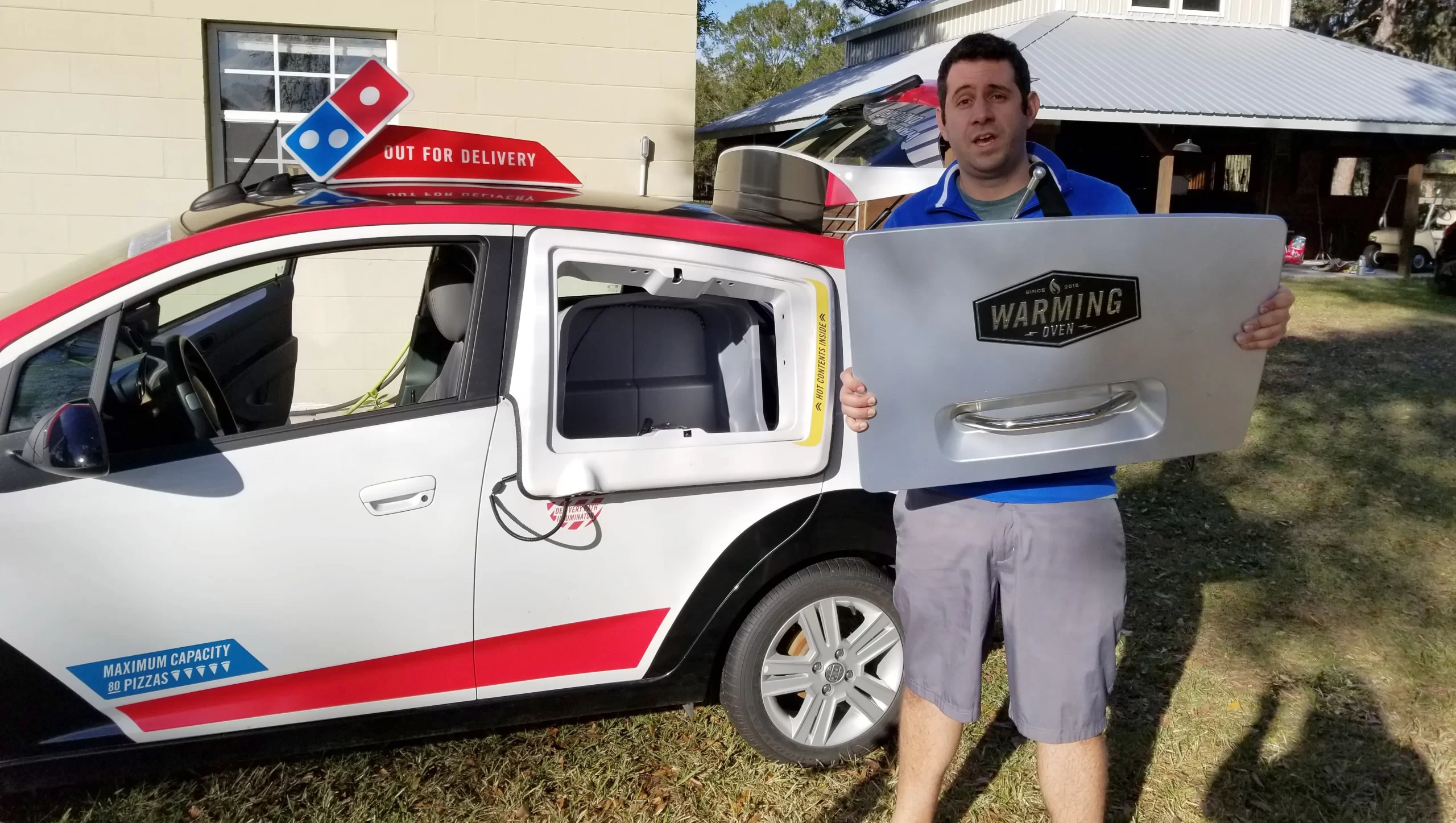 Man Faces Legal Action after Buying Domino's Pizza Delivery Car