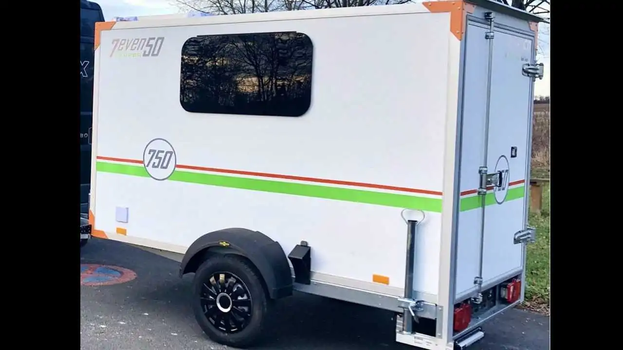 German company converts compact utility trailer to cozy camper for two