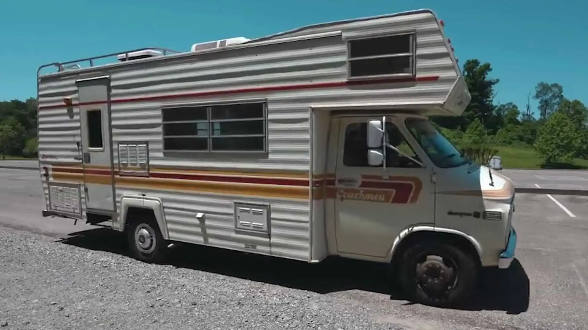 The Coachman RV features a spacious cabin with lots of wood trim