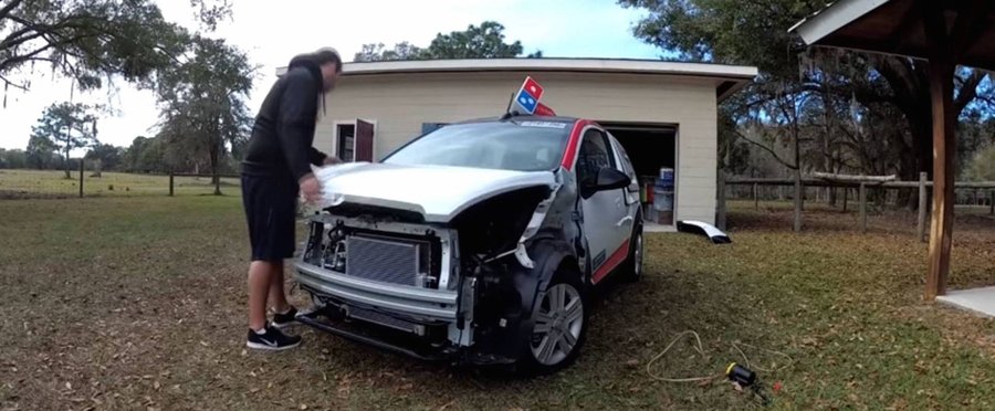 Man Faces Legal Action after Buying Domino's Pizza Delivery Car