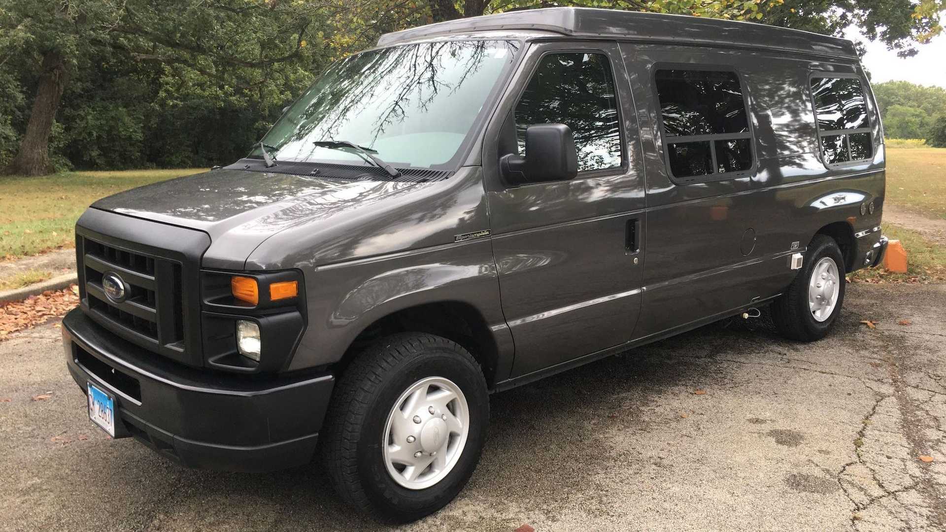 Custom Ford E-150 pop-top camper looks nice and could be yours