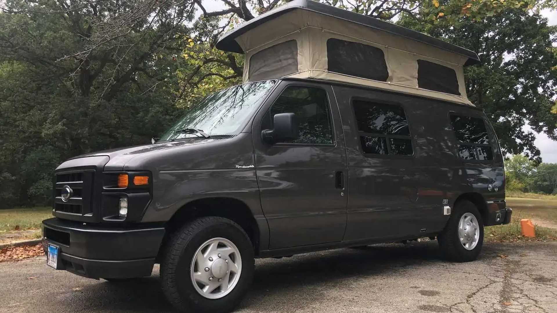 Custom Ford E-150 pop-top camper looks nice and could be yours