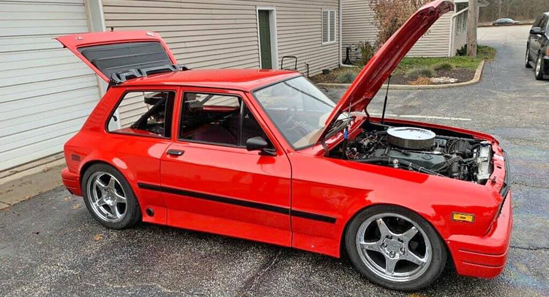 This Humble Yugo Hatchback runs on two Cadillac V8s and is for sale