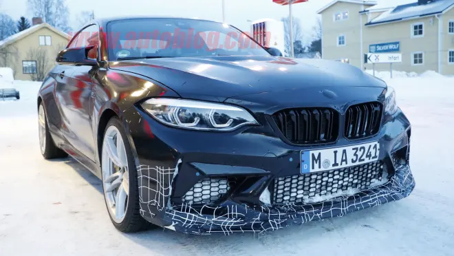 2020 BMW M2CS CS - Snow wearing a black suit