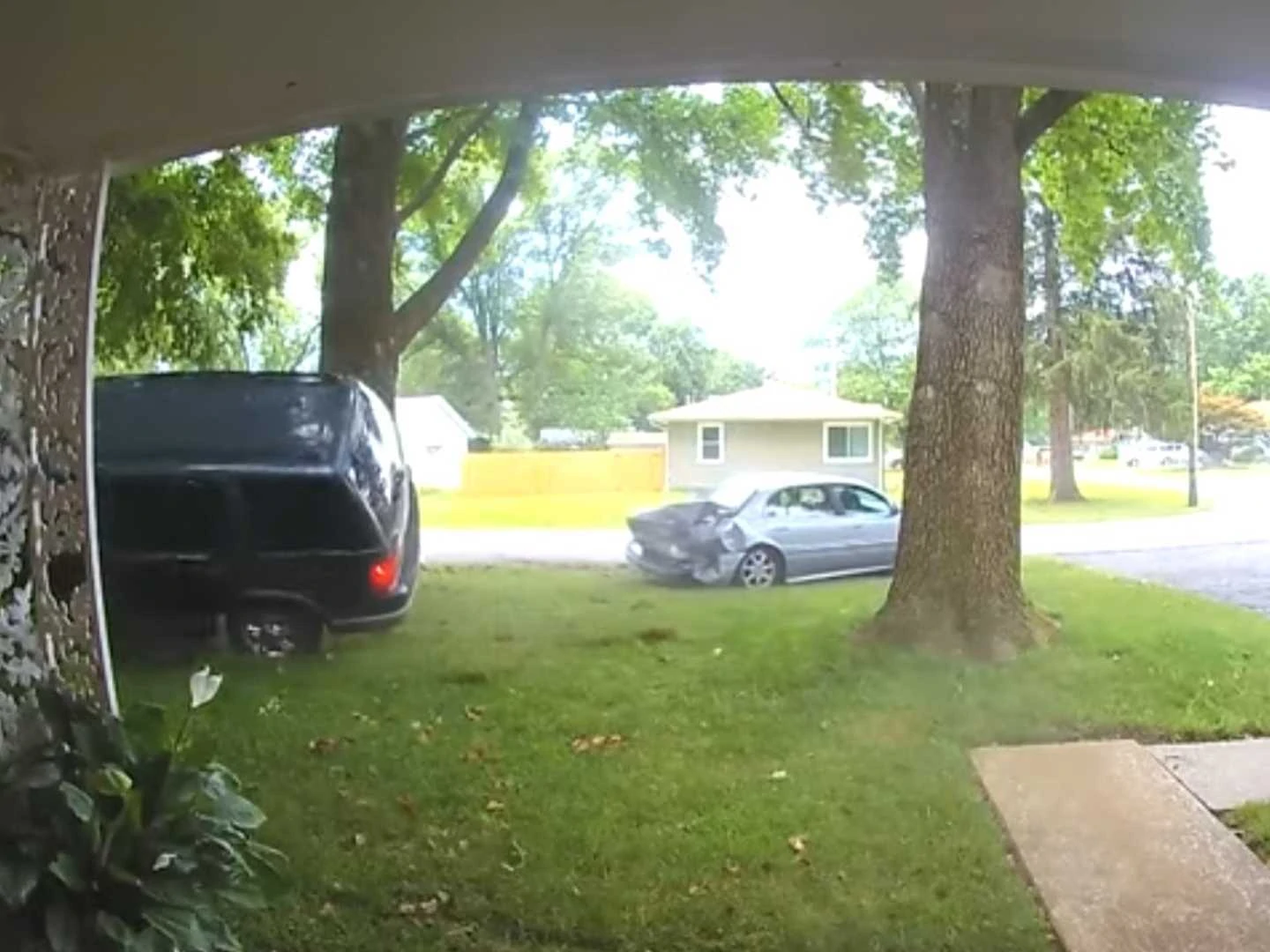 Crazy Crash: SUV Ram Car Into Front Yard; Everyone Runs Away