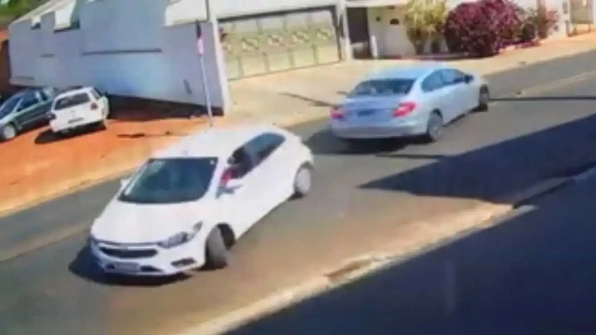 Two cars are captured in a synchronized collision