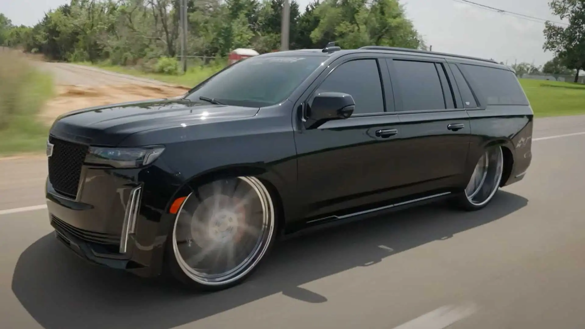 Slammed Cadillac Escalade on 30-Inch Wheels is Not for Everyone