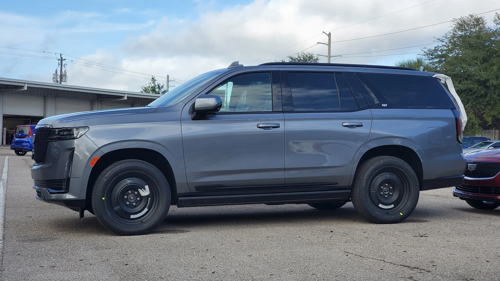 This is a rare sighting of a 2021 Cadillac Escalade on huge steelies