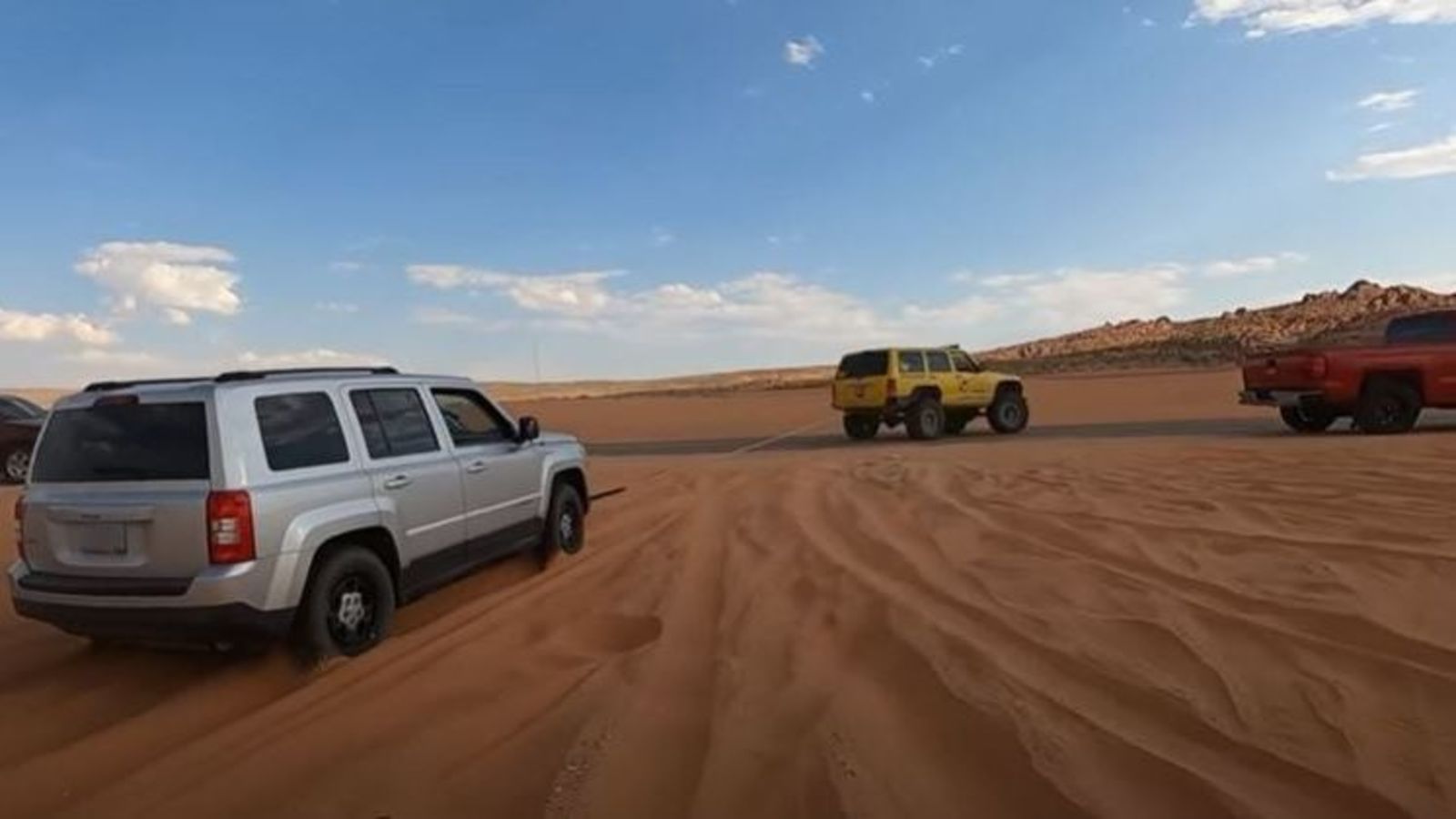 Watch Recovery Crew rescue 7 vehicles stuck in the same patch of sand