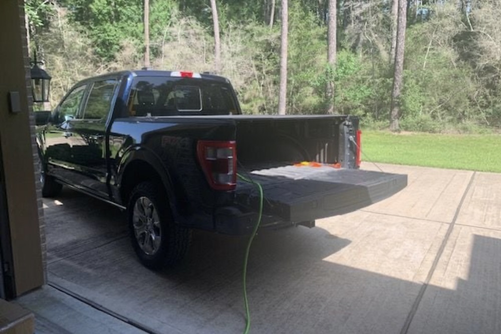 Ford F-150 hybrid powers house's space heater and lamp as neighborhood goes dark