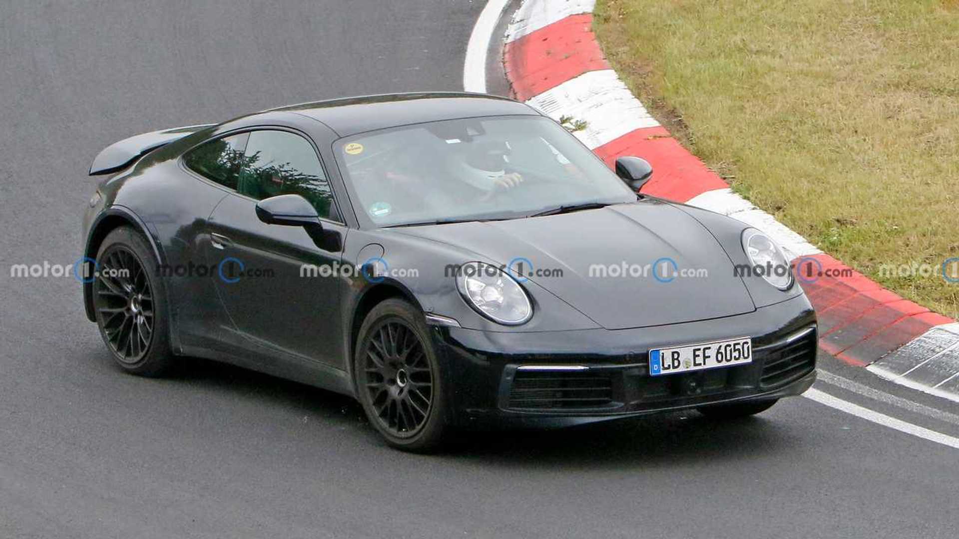 Porsche 911 Prototype Spied With Lifted Suspension, Chunky Arches