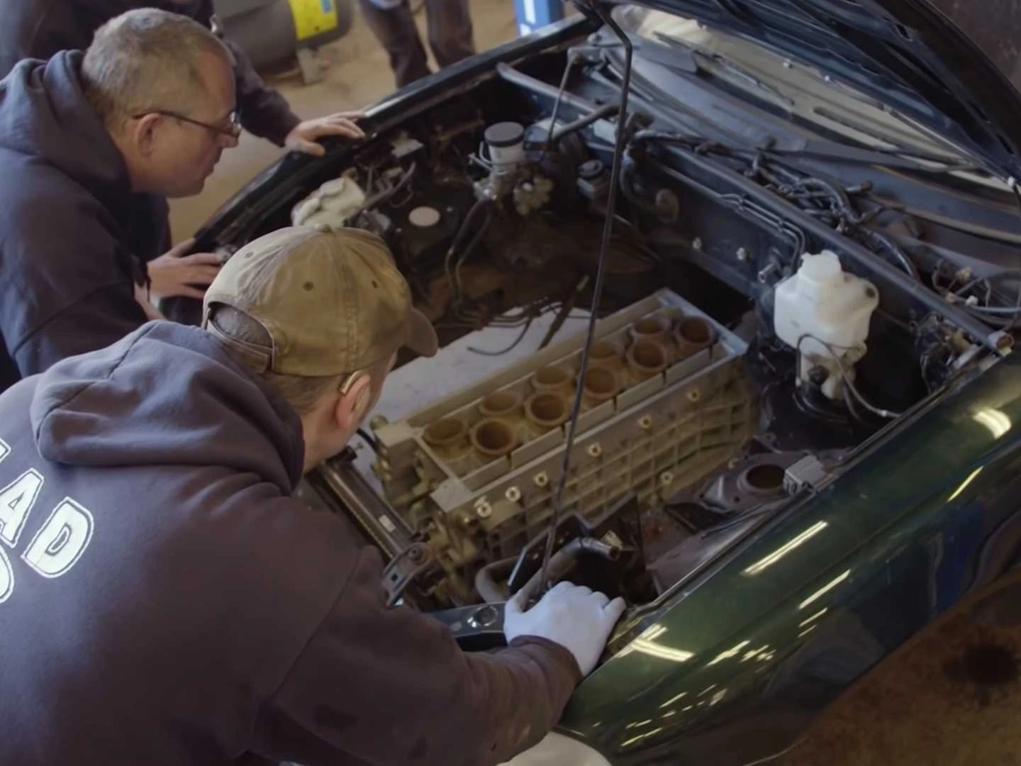 You can see a V10 engine slide into a Mazda Miata