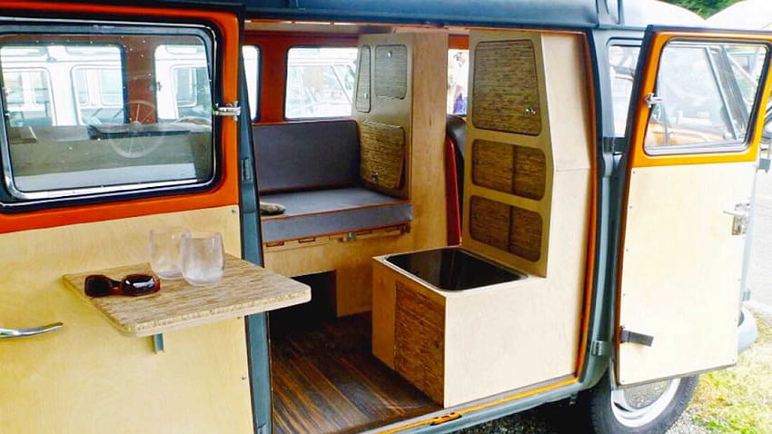 This tiny VW Camper van has a sectional sofa